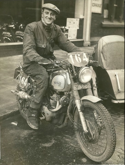 Photo of Eric Wilson, on his ex Works Norton 500 Dominator parked outside his workplace Victor Horsmans, the Liverpool Motorcycle Dealer. He rode the bike to and from the event iin Italy as well as picking up a Gold medal. ISDT 1951 (Courtesy Wilson Family Collection)
